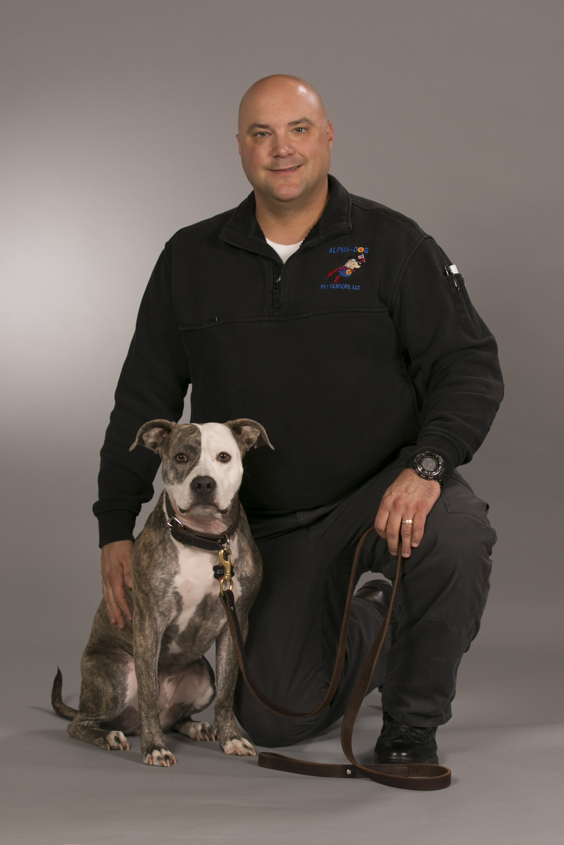 Photo of gray and white dog named Alex with her owner, Chip Ingersoll